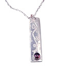 Engraved pendant with garnet